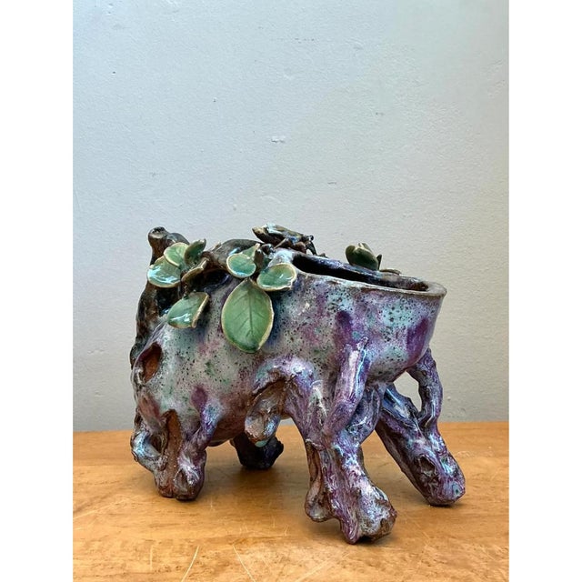 This vintage Sinwah Pottery faux bois cache pot is an exceptional study in sculptural ceramic artistry, its form emulating...
