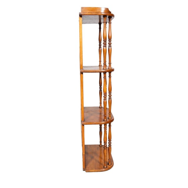 With a 3/4 wood gallery over three shelves all flanked by spindles. All with mirror backs.