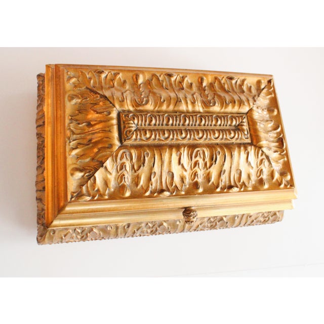 Ext Lg gilded Bombay Louis XVI style jewelry box, featuring a raised dimensional faux carved design. A elegant tarnish-...