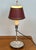 Quinquet table lamp (antique oil lamp) in silver-plated metal with a ratchet mechanism. Metal lampshade. (Small chip on...