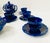 Polychrome earthenware tea and coffee service with a blue ground 14-piece set Six shaped pieces Eight cups and saucers...