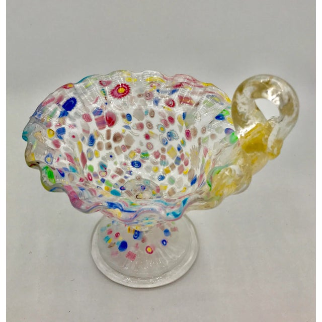This little gem of a bowl is just gorgeous. Milky white transparent base color is infused w hundreds of Murrines creating...