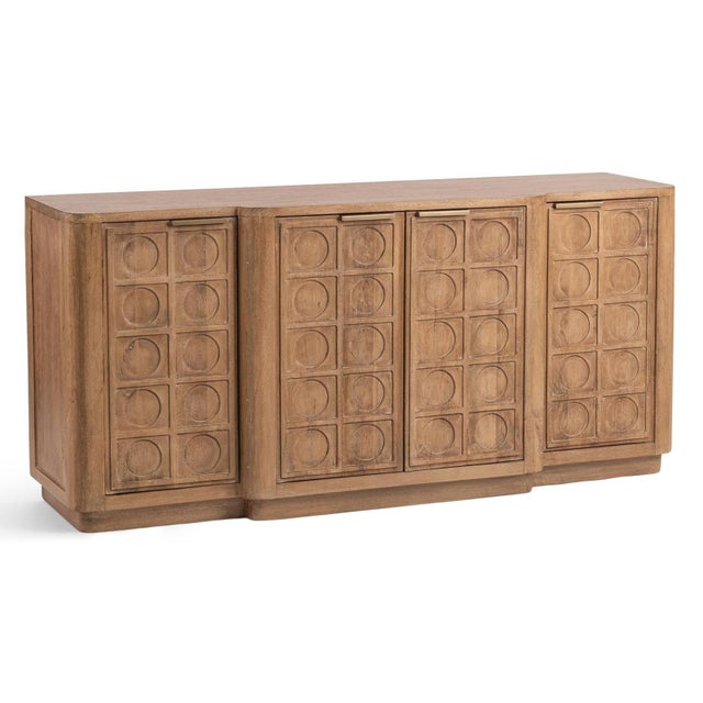 Warm sculptural sideboard crafted from richly grained mango wood in a natural finish. Four generously sized doors feature...