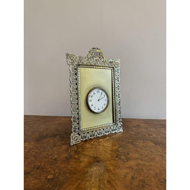 Elegant quality antique Victorian ornate brass desk clock, having a quality ornate brass frame with a circular dial to the...