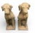 A handsome pair of vintage cast stone (reconstituted stone) statues depicting alert hunting dogs in a seated pose....