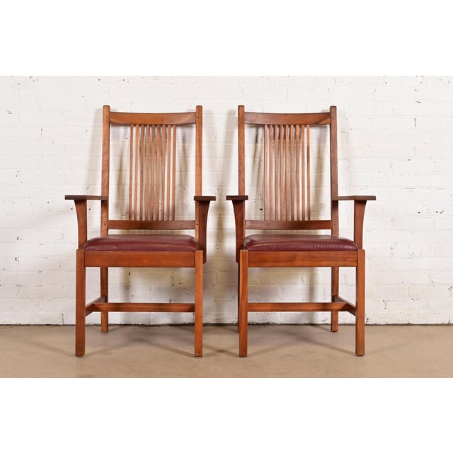 An exceptional pair of Mission or Arts & Crafts style spindle back armchairs or dining captain chairs By L. & J.G....