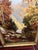 A beautiful over sized oil on canvas landscape painting in rich fall tones. Scene is vertical featuring a fall scene of a...