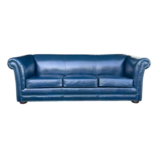 1960s Navy Blue Leather Roll-Arm Sofa With Brass Nailhead Trim and Wooden Bun Feet For Sale