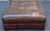 Handsome ottoman meticulously crafted in supple leather by Lee industries. Features a tufted design, square shape and...