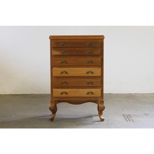 This stunning vintage Danish oak cabinet/dresser is a masterpiece of mid-century craftsmanship, blending timeless design...