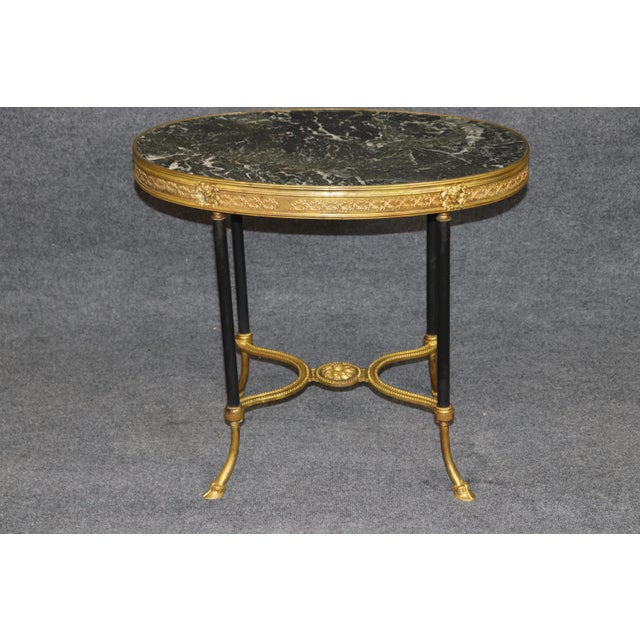 French Marble-Top Guéridon in the Manner of Adam Weisweiler, Louis XVI Style An exceptionally elegant French marble-top...