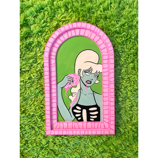 This artwork depicts a stylized figure with a pale, greenish complexion and a playful yet haunting expression, holding a...