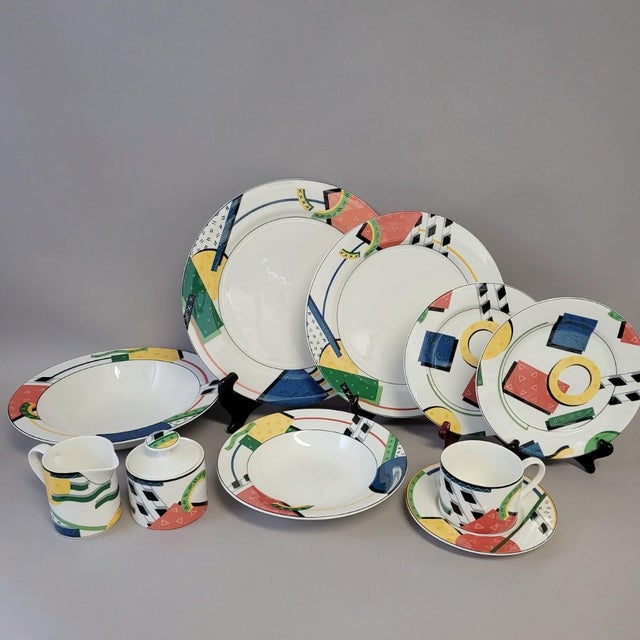 A vibrant 39-piece porcelain dinnerware service from the Elements pattern by Victoria & Beale, designed by Soojin Choi and...