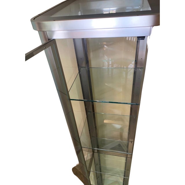 This sleek, contemporary curio display cabinet features a brushed silver metal frame with full glass panels on all four...