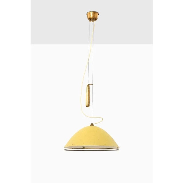 Rare and large ceiling lamp designed by Paavo Tynell. Produced by Taito Oy in Finland. Height: 117-160 cm. This piece is...