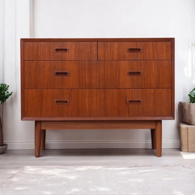 Lyby Mobler Danish teak four drawer chest. The compact chest stands and just over 35″ wide. It is the ideal piece for a...