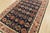 An authentic vintage tribal Heriz rug hand-knotted with fine wool on a cotton foundation. This rug features rows of...