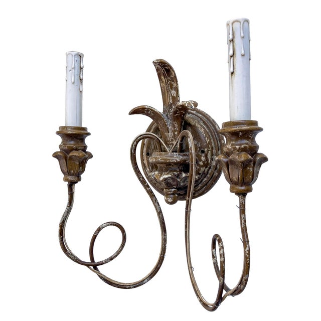 A Vintage Pair of whimsical French Style Wall Sconces. Each has 2 Faux Candle holders for flame light bulbs and Fleur De...