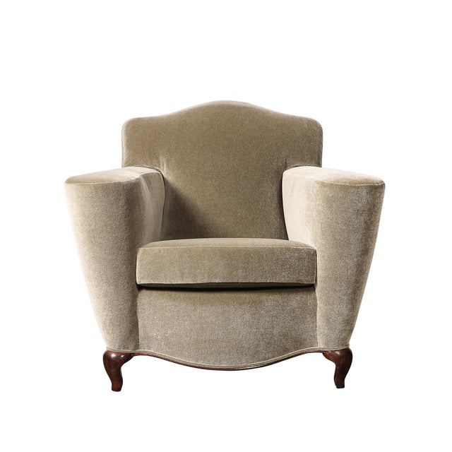 This pair of Art Deco sinuous club chairs, crafted in France, circa 1935, represents the height of refined Art Deco...