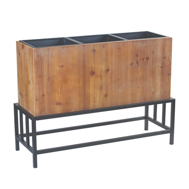 Showcase your greenery in style with this Triple Planter on Stand. Measuring 36.5" long, this piece features three...