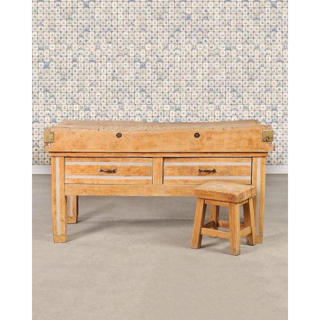 A richly patinated French butcher's block island, boucherie, or billot de boucher worktable in the French Country...