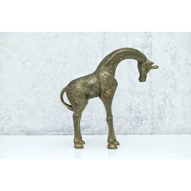 Brass giraffe figurine This listing is for a sweet brass giraffe figurine. Place this charming piece in any room for a...