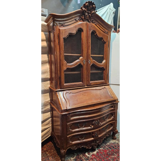 Beautifully carved, country French Louis XV style secretary desk with hutch. Easily repurposed as a bookcase or Bar...