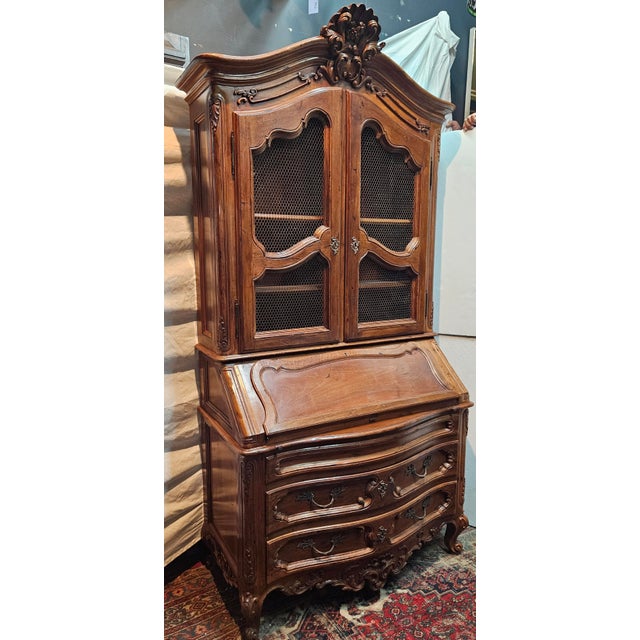 Beautifully carved, country French Louis XV style secretary desk with hutch. Easily repurposed as a bookcase or Bar...