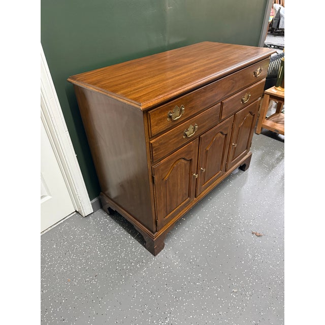 Chippendale style serving cabinet by Henkel Harris. Made in Winchester, Va in the 70’s. It features solid wild black...