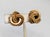 Goldtone smooth and rope textured loopy "knot" clip earrings. Marked "19 GROSSE© 69 GERMANY" on the bases of the clips....