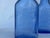 Two wonderful PHILLIPS MILK OF MAGNESIA blue glass bottles from approximately 1930's - 1960's.