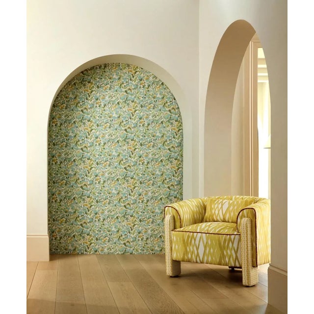 This surface-printed wallpaper translates beautifully on the wall with saturated tones of blue and green blurring the...