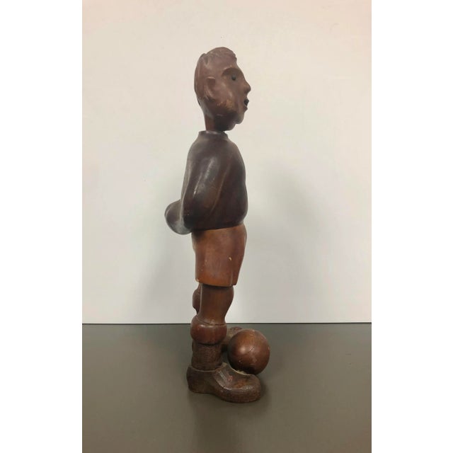 Charming hand carved sculpture of a soccer player, very old piece of art, from the 1920’s . This piece is in very good...