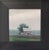 This oil on panel depicts a solitary barn set against a moody, rain-soaked landscape, enveloped in soft, muted tones. The...