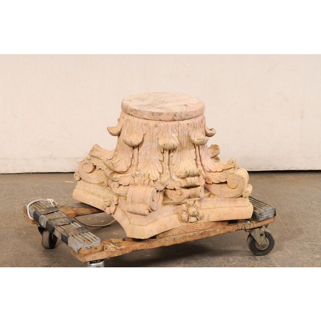 A Spanish hand-carved sandstone pedestal or column base. This vintage architectural stone column base from Spain, standing...