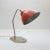 This is a well preserved Slovenian table lamp with a crimson shade and metal neck exhibiting patina. This piece is...