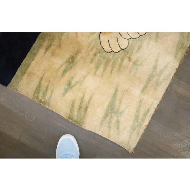An accent-size Tibetan Rug depicting a large Tiger from the early 20th Century Details rug no. j4643 size 4' x 6' (122 x...