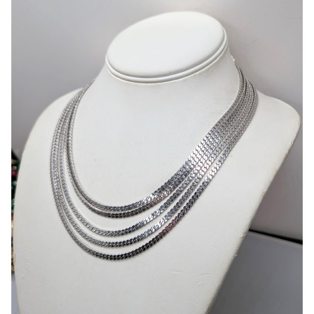 1970s rhodium plated 5 chain necklace with fold over clasp and extender. Marked "MONET©" on both the fold over clasp and...