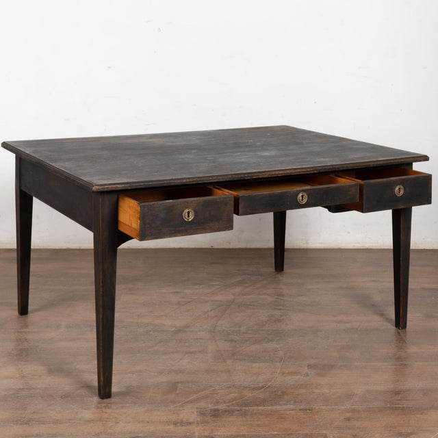 19th-century pine partner’s desk with a newer black painted finish, gently distressed to reveal natural pine beneath and...