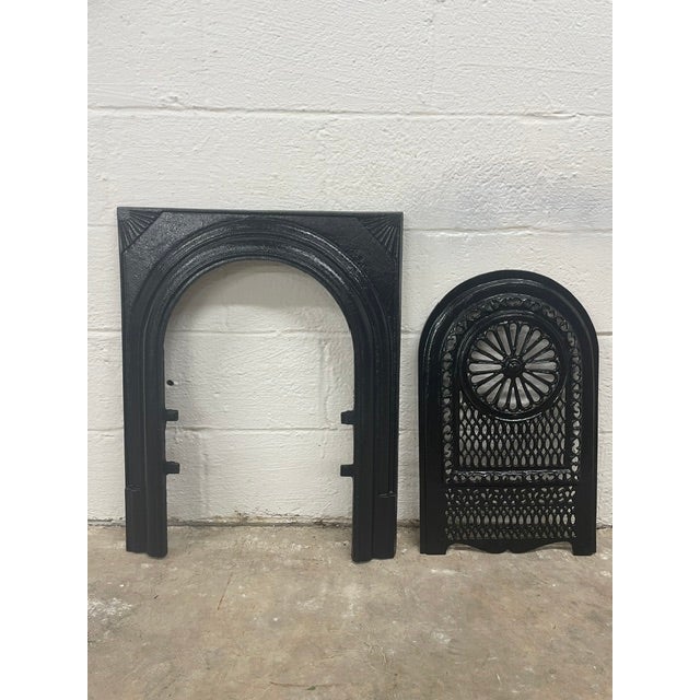 A remarkable piece of Southern architectural history, this late 19th-century cast iron fireplace surround and matching...