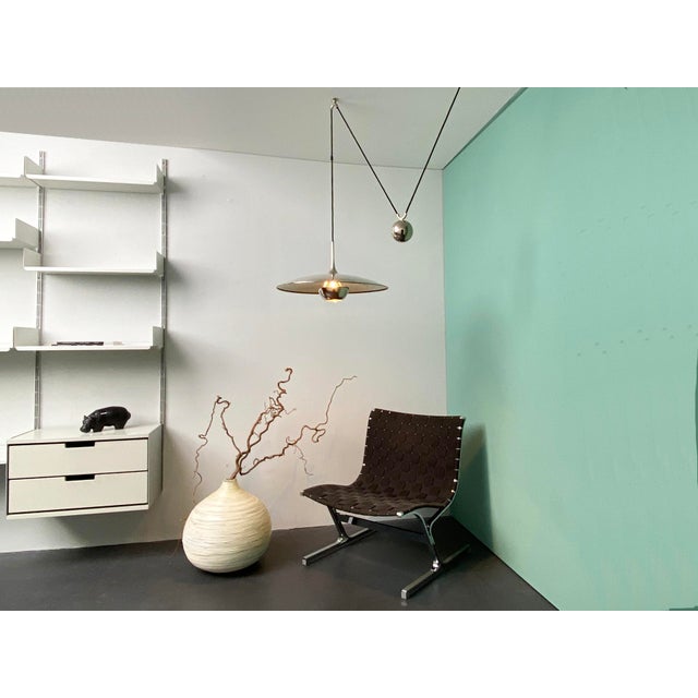 Onos 55 Pendulum Train Ceiling Lamp in Chrome-Plated Brass by Florian Schulz, Germany, 1970s, in Very Good conditions....