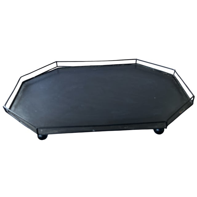 This glass and metal tabletop greenhouse features crisp faceted geometry and a classic black metal frame, offering a...