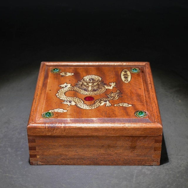 A dignified Chinese square hardwood drawer box (shouhe) crafted from warm-toned huali rosewood, with visible dovetail...