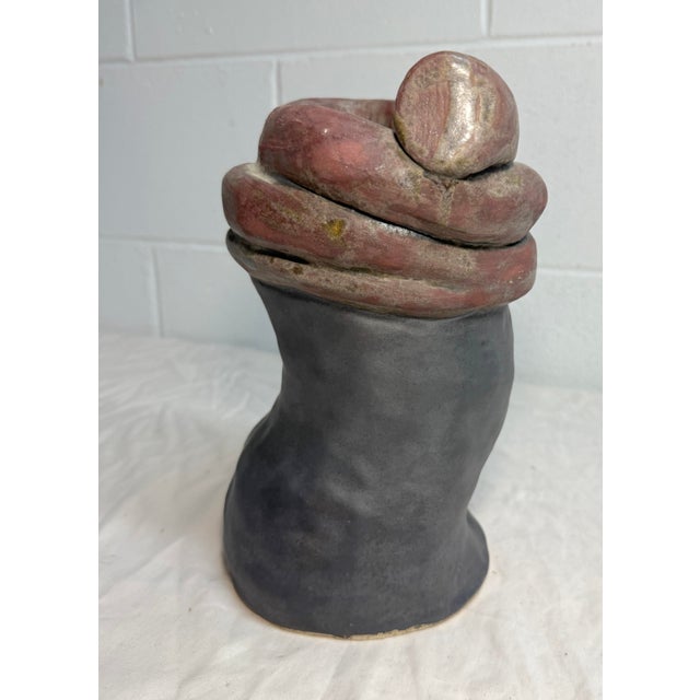 Crafted with a keen eye for detail, this vintage vase silhouette sculpture embodies the essence of brutalist design. The...