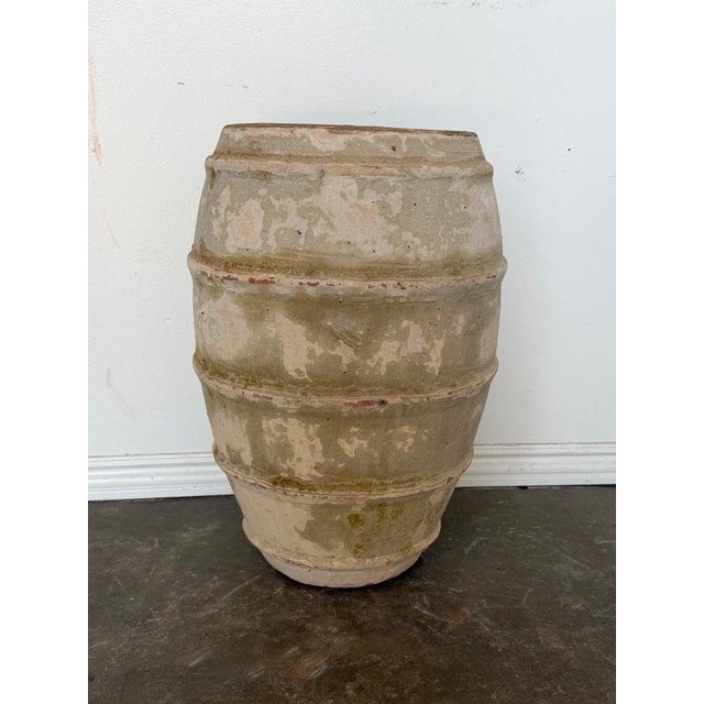 A sculptural and highly atmospheric large-scale barrel-form planter in classic Mediterranean olive jar form. The vessel...