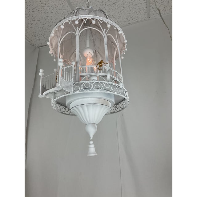 Bring a touch of architectural charm to your space with this beautifully crafted hanging gazebo‑style lantern. Designed...