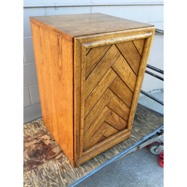 Mid-century brutalist oak nightstand, end table, cabinet, with door, and inner shelf, manufactured by Dixie Furniture...