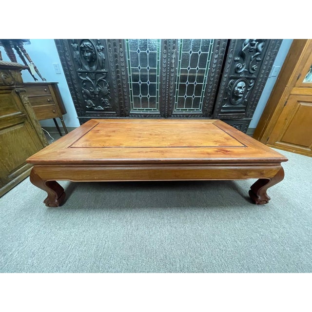 Up for sale is a vintage coffee table made of solid walnut wood. The table is extremely sturdy with thick handcarved ball...