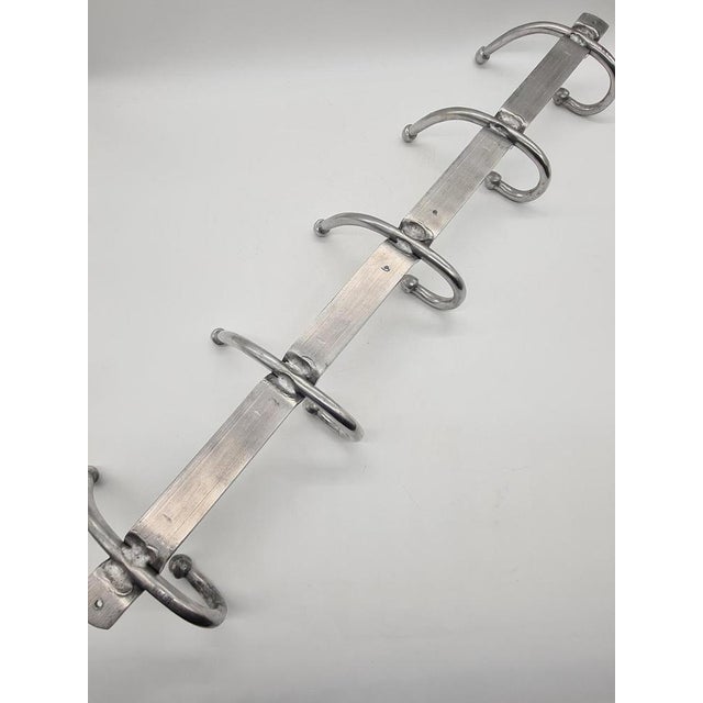 An original aluminum wall hook with a minimalist, modernist design. This model features five double hooks and is crafted...