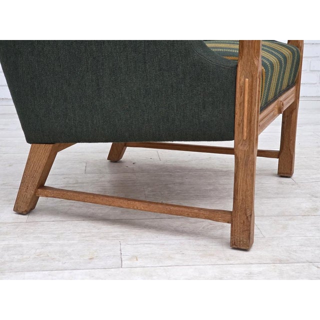 1970s, Danish armchair. Original green furniture wool, solid oak wood, brass in seat. Original good condition: no smells,...